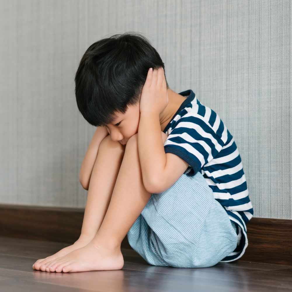 A,Little,Boy,Sitting,At,The,Corner,Of,The,Room
